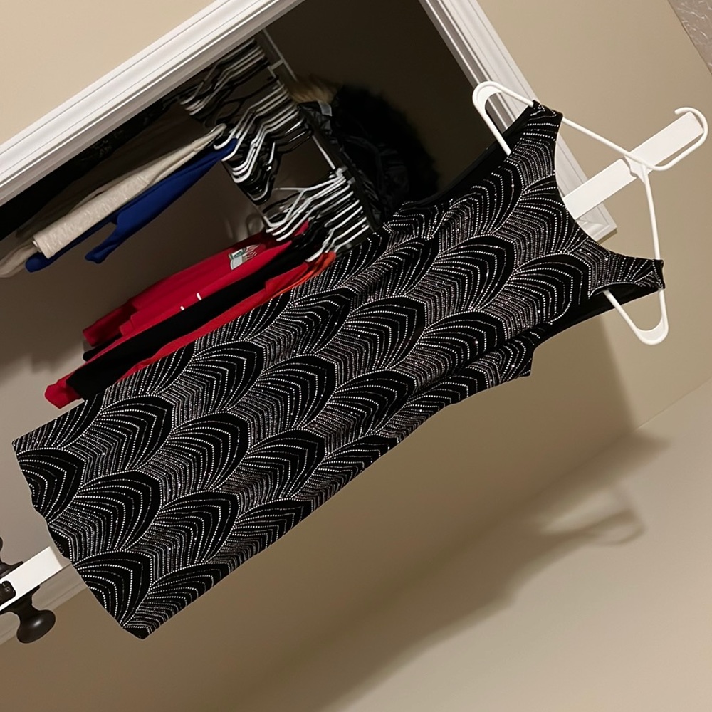 Cute dress, tight fitting but very stretchy and flattering